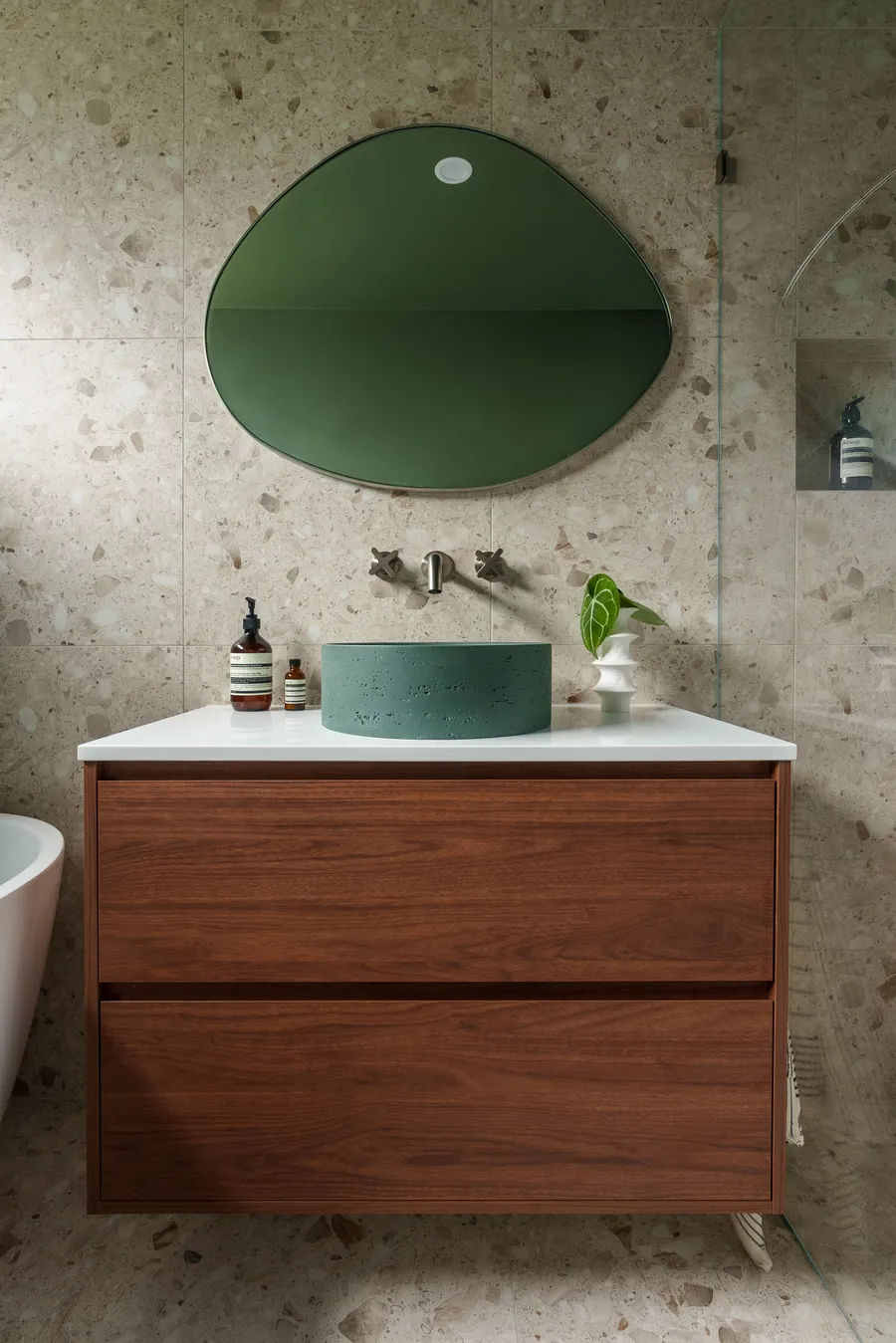 Green vanity with timber joinery and organic mirror, Grange Drive bathroom by MNA Builds