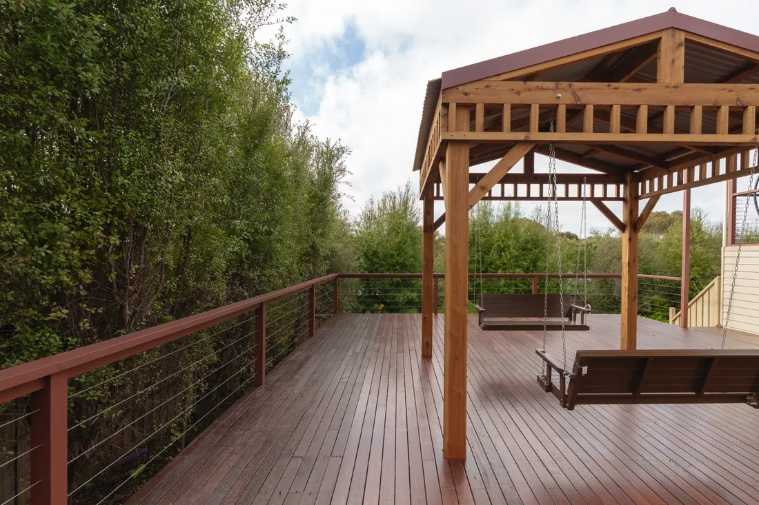 Custom timber pergola and deck with garden outlook by MNA Builds