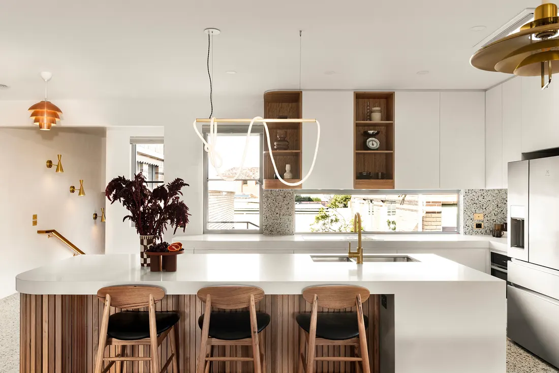Luxury kitchen with island bench, timber and terrazzo by MNA Builds